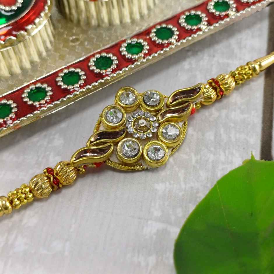 Gullak Kundan Flower With Golden Leaf Rakhi