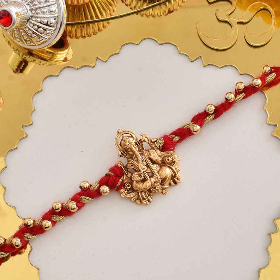 Rakhi for Brother | Divine Red Thread Ganesh | Religious | Pack of 1 |Included Roli Chawal | Voylla