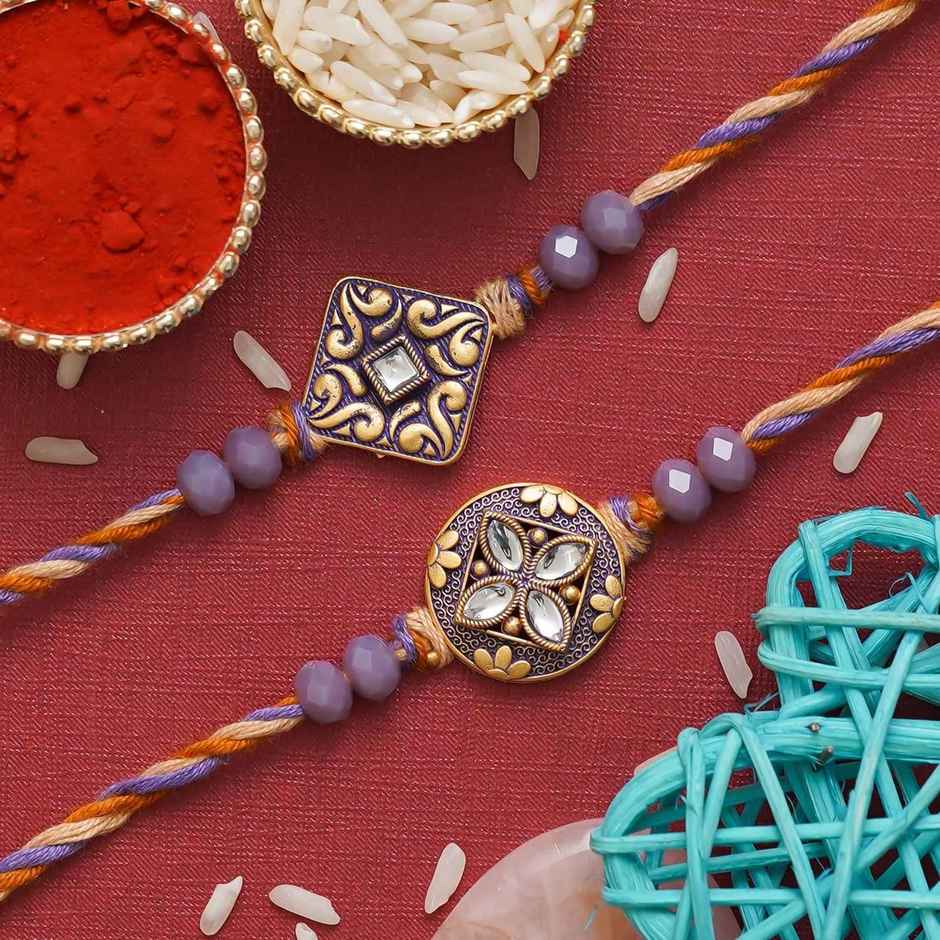 Stone Purple and Golden Precious Stone Designer Rakhis & Roli Chawal Pack (eCraftIndia) Set of 2
