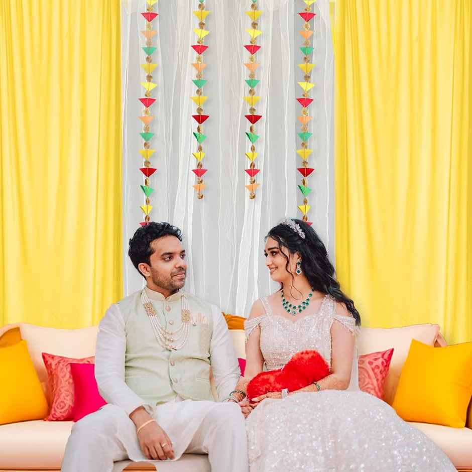 White and Yellow Net Backdrop with Triangle Hanging for Haldi Mehndi | Party Propz