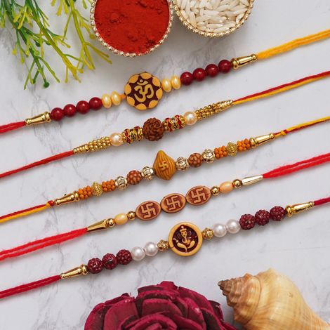 Religious Multicolor Om, Rudraksha, Swastik, Pearls, Ganesha Religious Designer Rakhis & Roli Chawal Pack (eCraftIndia) Set of 5