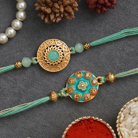 Stone Light Blue & Golden Premium Designer Rakhis & Roli Chawal Pack (eCraftIndia) Set of 2