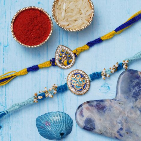 Religious Lord Ganesha & Beautiful Peacock Rakhis for Brother, Bhabhi, Kids & Roli Chawal Pack (eCraftIndia) Set of 2