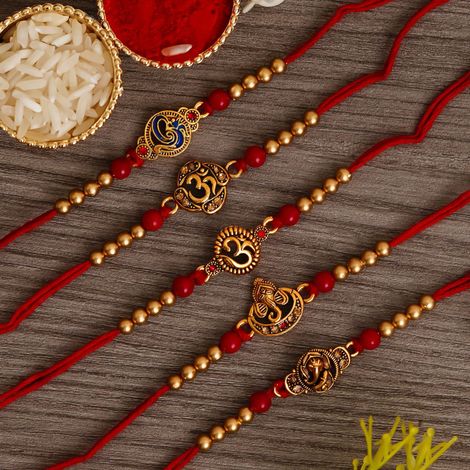 Religious Red & Golden Om Symbol and Lord Ganesha Designer Rakhis & Roli Chawal Pack (eCraftIndia) Set of 5