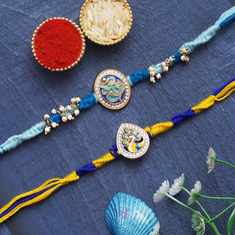 Religious Lord Ganesha & Beautiful Peacock Rakhis for Brother, Bhabhi, Kids & Roli Chawal Pack (eCraftIndia) Set of 2