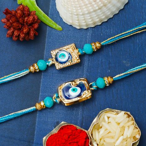 Evil Eye Golden Blue Rakhi for Bhaiya, Bhai, Bhabhi and Kids with Roli Chawal Pack (eCraftIndia) Rakhi Set of 2