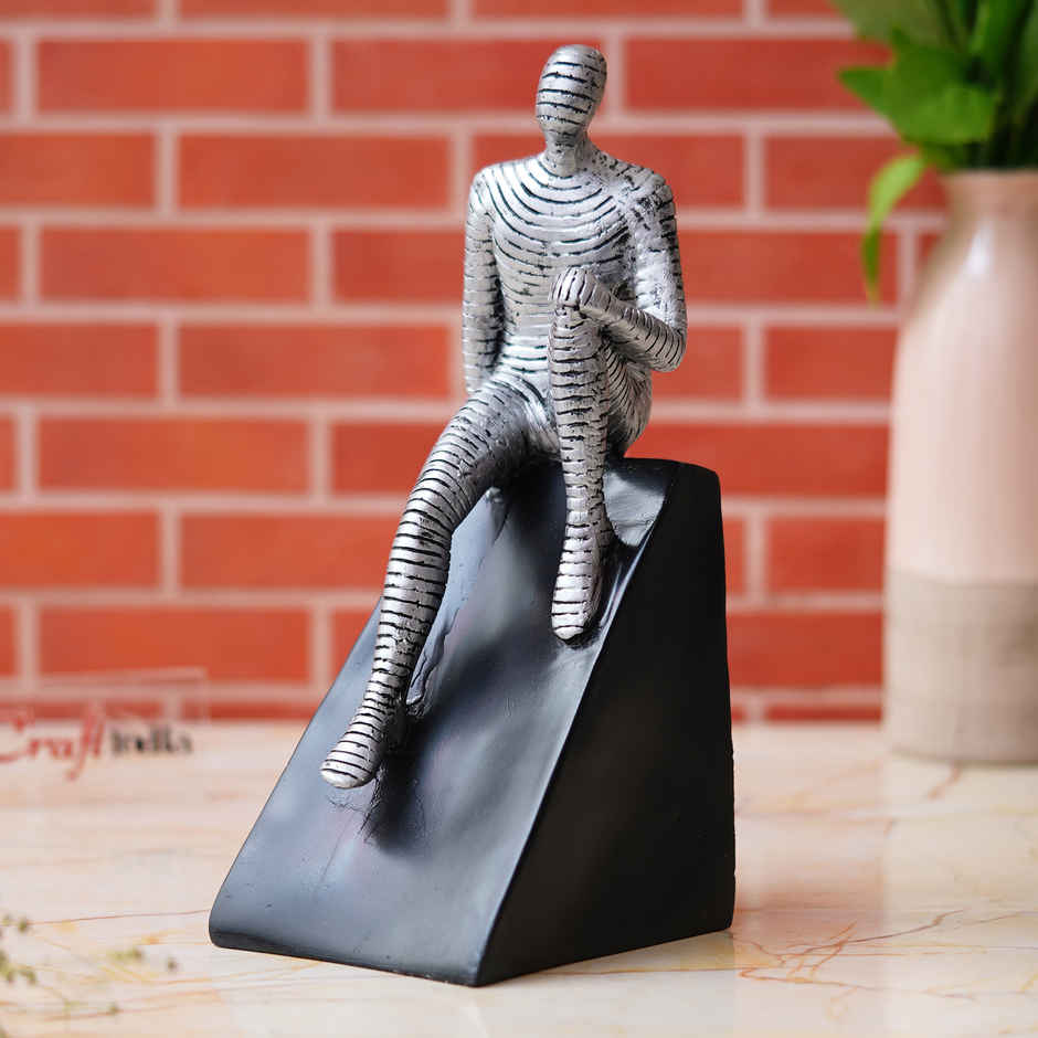 eCraftIndia Silver Man Statue Sitting on Triangle Black Base Human Showpiece