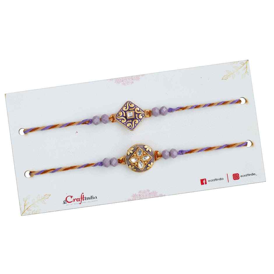 Stone Purple and Golden Precious Stone Designer Rakhis & Roli Chawal Pack (eCraftIndia) Set of 2