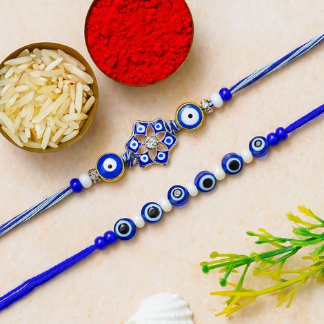 Evil Eye Floral Rakhis for Bhaiya, Bhai, Bhabhi and Kids with Roli Chawal Pack (eCraftIndia) Set of 2