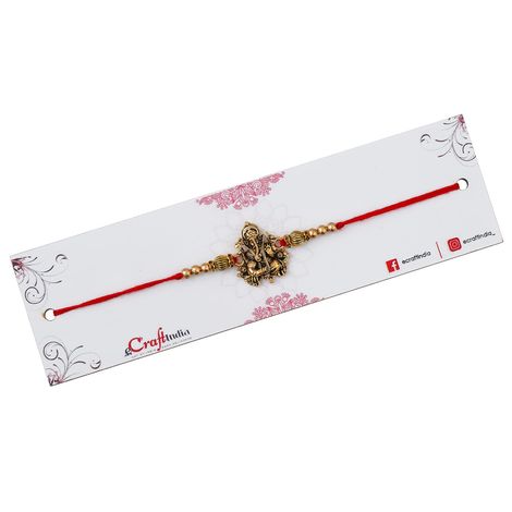 Religious Golden Designer Ganesha Rakhi for Brother with Red Thread, & Roli Chawal Pack (eCraftIndia)