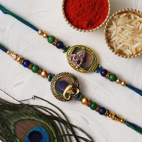 Religious Lord Ganesha and Krishna Peacock Feather Religious Rakhis for Brothers & Roli Chawal Pack (eCraftIndia) Set of 2