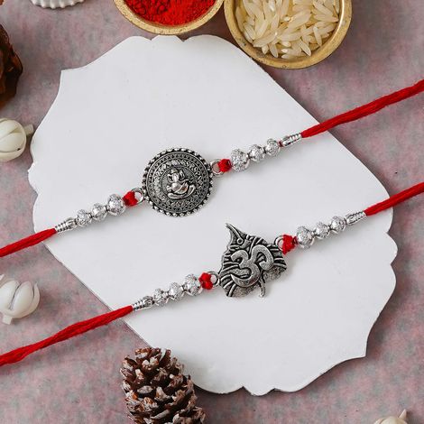 Religious Lord Ganesha and Om Symbol Religious Rakhis for Brothers & Roli Chawal Pack (eCraftIndia) Set of 2