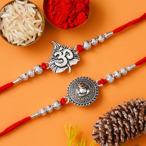 Religious Lord Ganesha and Om Symbol Religious Rakhis for Brothers & Roli Chawal Pack (eCraftIndia) Set of 2
