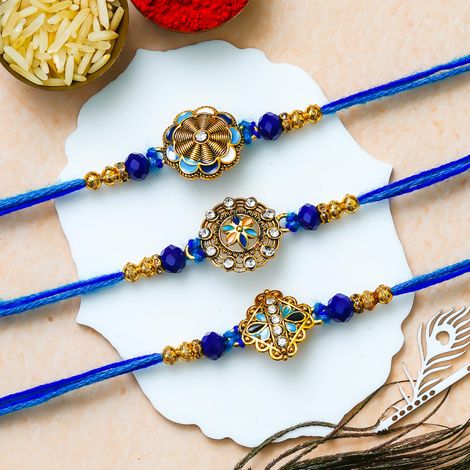 Floral Blue Golden Designer Rakhi for Bhaiya, Bhai, Bhabhi and Kids with Roli Chawal Pack (eCraftIndia) Set of 3