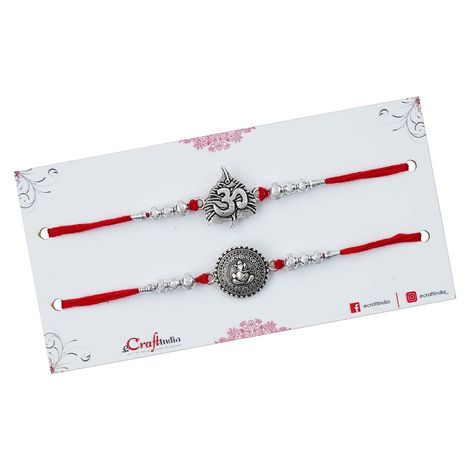 Religious Lord Ganesha and Om Symbol Religious Rakhis for Brothers & Roli Chawal Pack (eCraftIndia) Set of 2