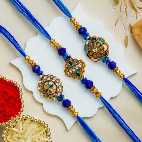 Floral Blue Golden Designer Rakhi for Bhaiya, Bhai, Bhabhi and Kids with Roli Chawal Pack (eCraftIndia) Set of 3