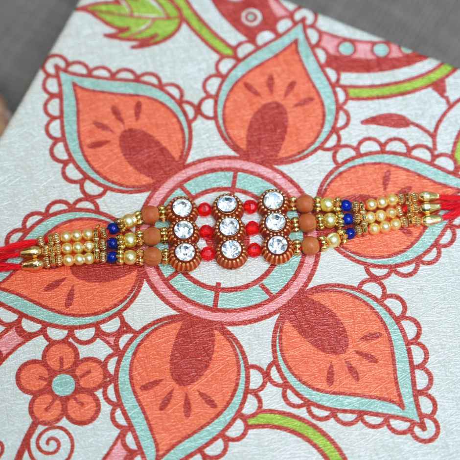 Cadbury Chocobakes Choclayered Cakes(114gms) & Aurum Premium Big Rakhi With Diamond & Bead Bracelet(1pc) Combo