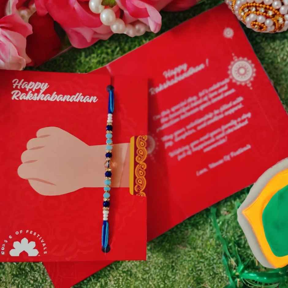 Amul Fruit 'N' Nut Chocolate(150gms) & Beautifully Weaved Dori Rakhi With Blue & White Shade Moti(1pc) Combo