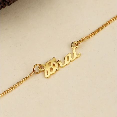 Gold-Toned Rakhi Bracelet Engraved with The Word 'Bhai' with Roli Chaawal Pack (Voylla)
