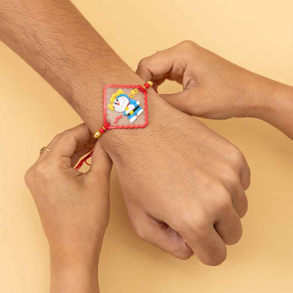 Kids Doraemon and Peepa Pig Rakhi with Roli Chawal (Tied Ribbons) Pack of 2