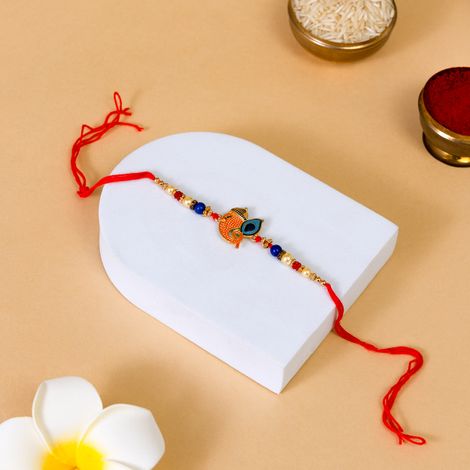 Religious Ganesha With Moor Pankh Rakhi Curated To Bless Brothers (BANDHAN)
