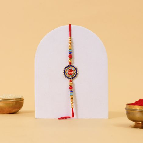 Stone Om Round Rakhi With Stone And Meenakari Work (BANDHAN)