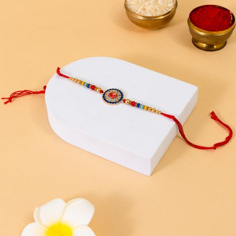 Stone Om Round Rakhi With Stone And Meenakari Work (BANDHAN)