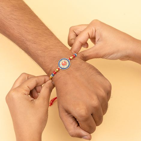 Stone Om Round Rakhi With Stone And Meenakari Work (BANDHAN)