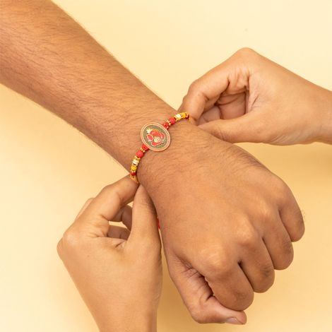 Religious Ganesha Sindoori Orange Meenakari Rakhi (BANDHAN)