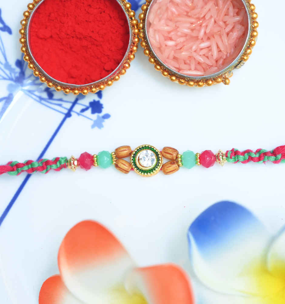 Fabelle Chocolate Home Pack Mini Delights Assorted Treats Pack(140gms) & Aurum Kundan Rakhi With Beads(1pc) Combo