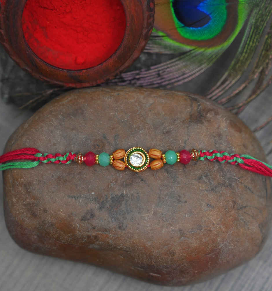 Fabelle Chocolate Home Pack Mini Delights Assorted Treats Pack(140gms) & Aurum Kundan Rakhi With Beads(1pc) Combo