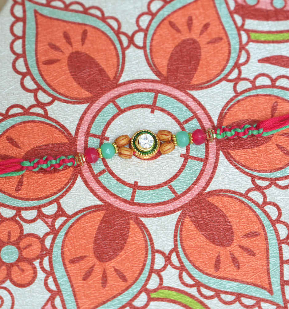 Fabelle Chocolate Home Pack Mini Delights Assorted Treats Pack(140gms) & Aurum Kundan Rakhi With Beads(1pc) Combo