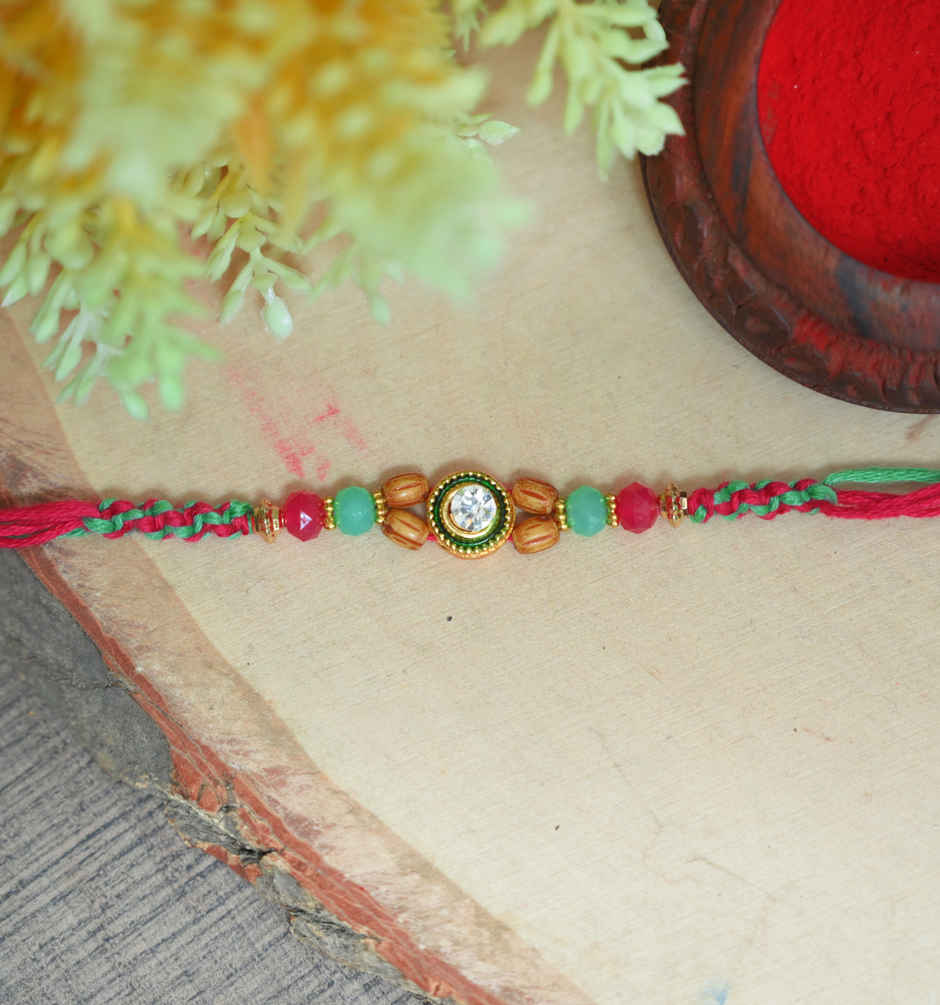 Fabelle Chocolate Home Pack Mini Delights Assorted Treats Pack(140gms) & Aurum Kundan Rakhi With Beads(1pc) Combo