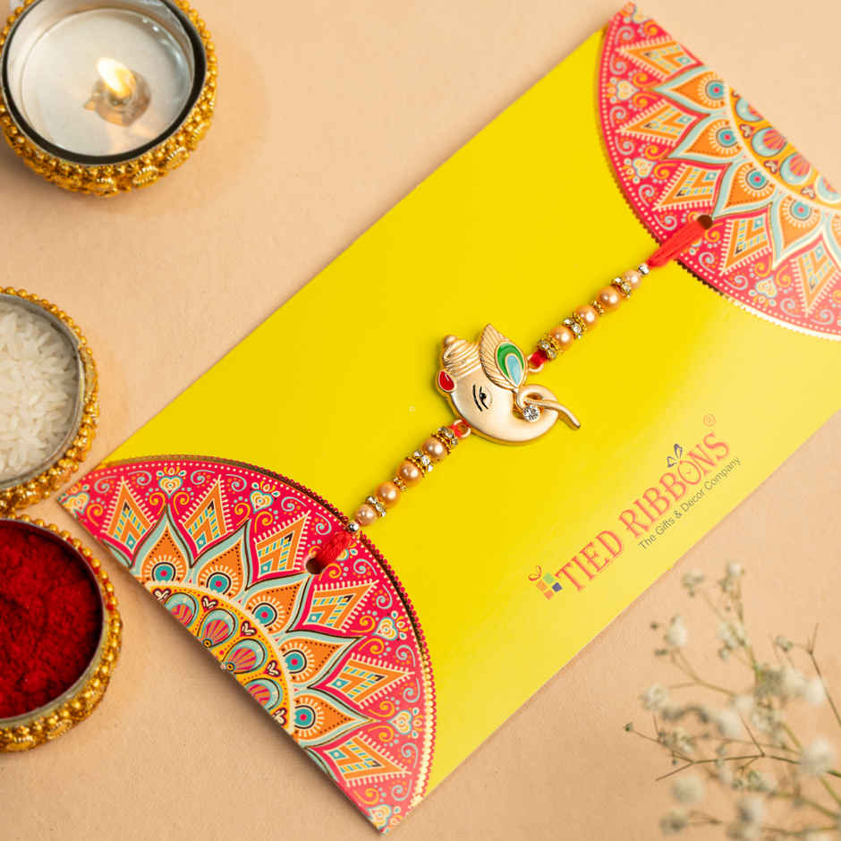 Rakhi for Brother | Ganesha Designer | Religious | Includes Roli Chawal | Pack of 1 | Tied Ribbons
