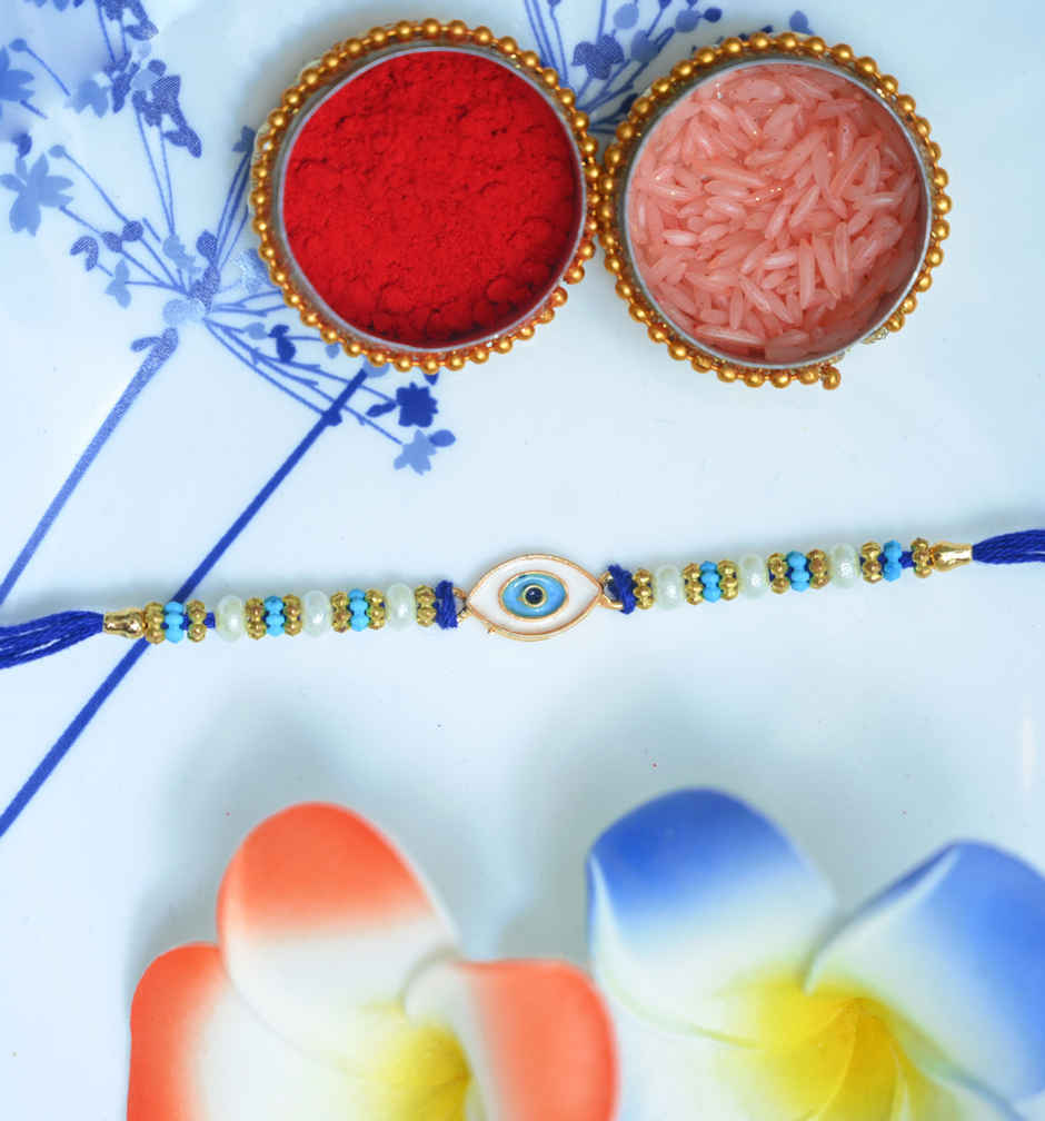 Lindt Lindor Smooth Melting Assorted Chocolates Cornet(200gms) & Aurum Blue Evil Eye Rakhi Multiple Pearls & Beads(1pc) Combo