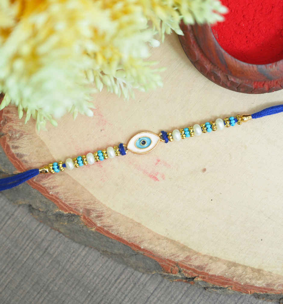 Lindt Lindor Smooth Melting Assorted Chocolates Cornet(200gms) & Aurum Blue Evil Eye Rakhi Multiple Pearls & Beads(1pc) Combo