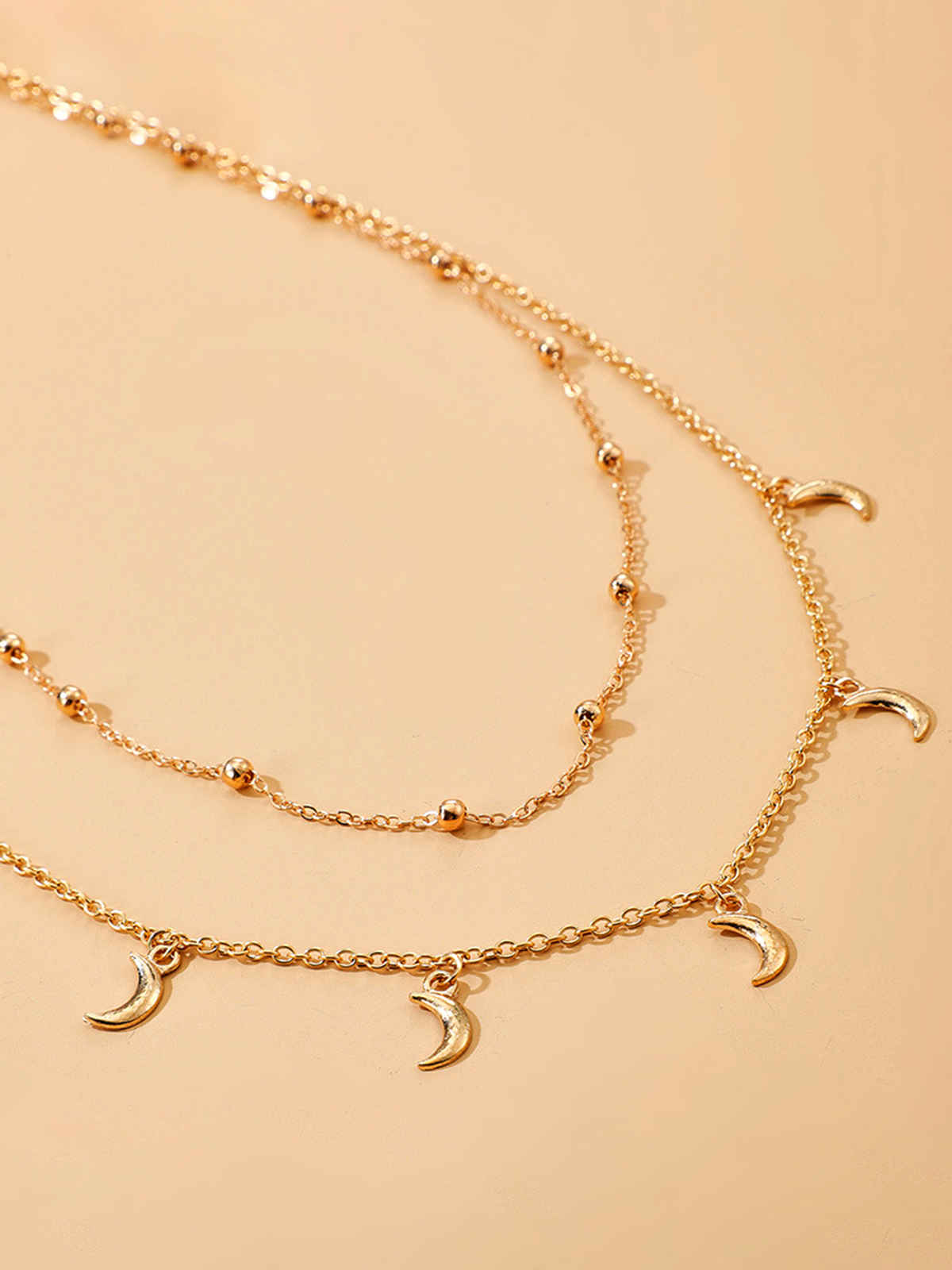 Unwind By Yellow Chimes Gold-Toned Multilayered Crystal Studded Moon Charm Waist Chain