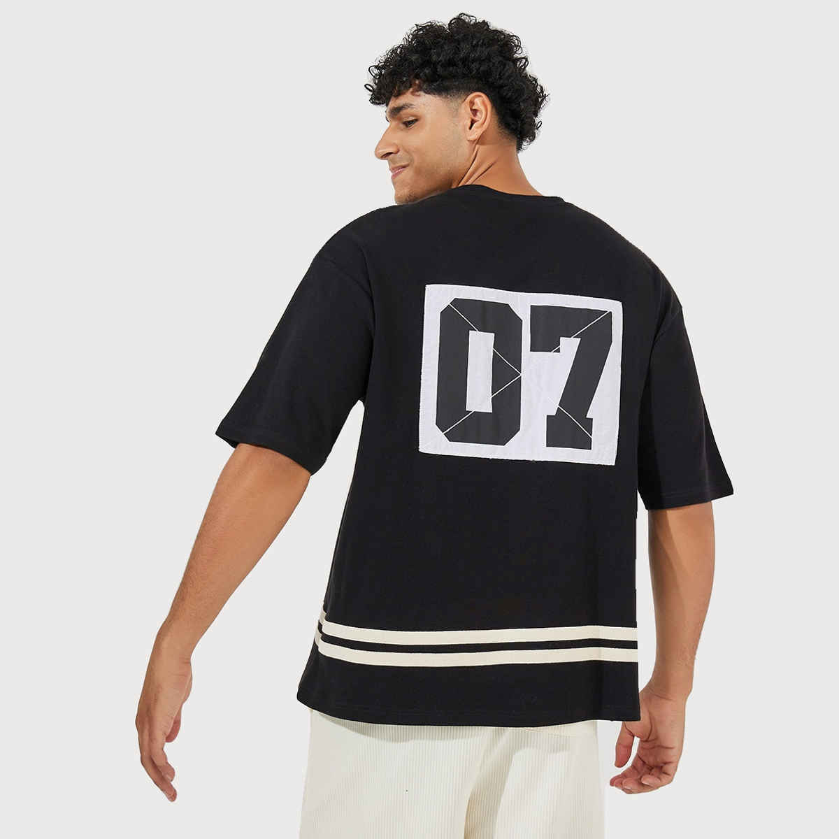 Styli Men's Oversized T-shirt with Back Printed Panel and Striped Hem | Black - XL