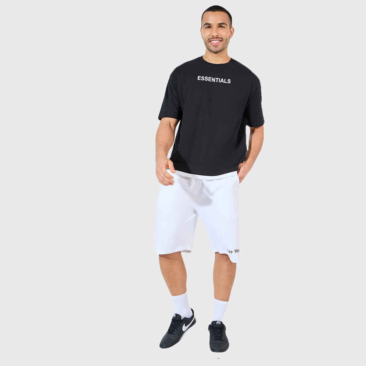 Styli Men's Oversized T-shirt with Essential Chest Print and Contrast Hem | Black - S