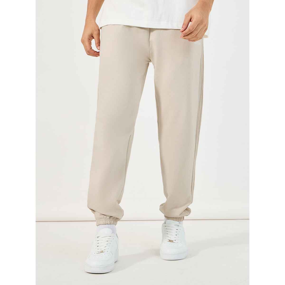 Styli Men's Jogger with Oversized Fit, Pintucks and Embroidery | Off White - L