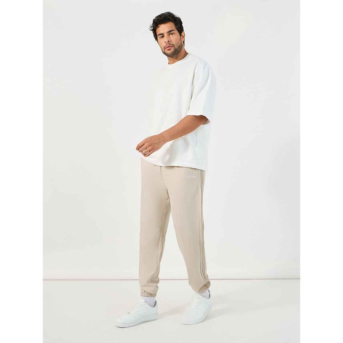 Styli Men's Jogger with Oversized Fit, Pintucks and Embroidery | Off White - L