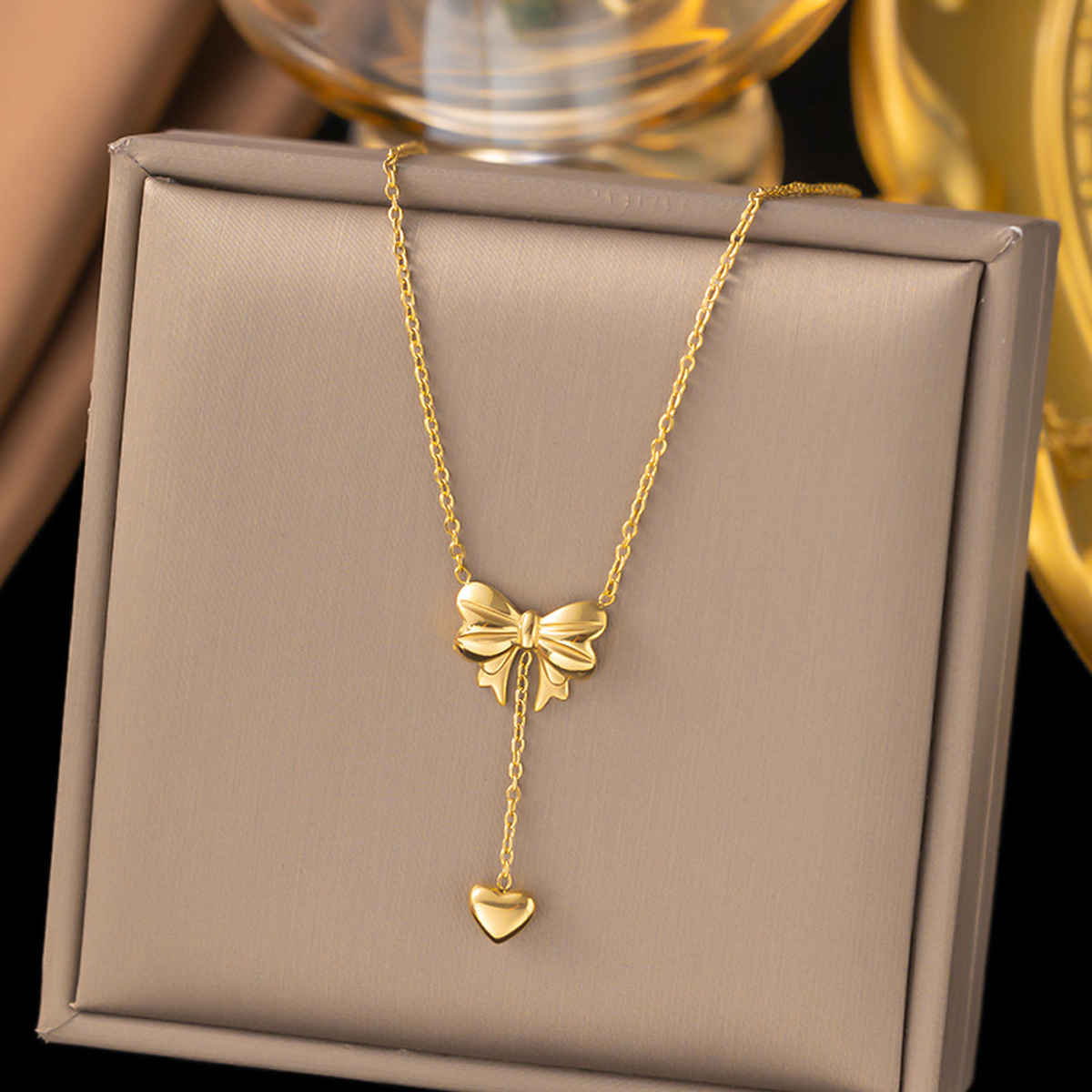 LabelShe Gold Plated Stainless Steel Heart Themed Bow Inspired Necklace | LS-NCK-67028