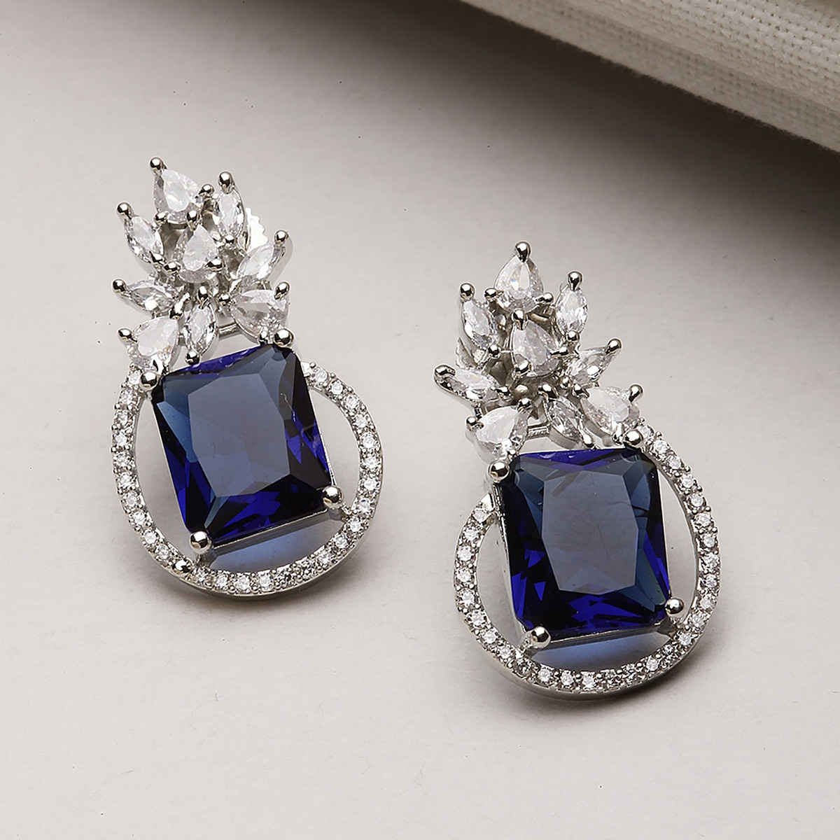 Zeneme Rhodium-Plated American Diamond studded Paisley Shaped Studs Earrings For Women & Girls