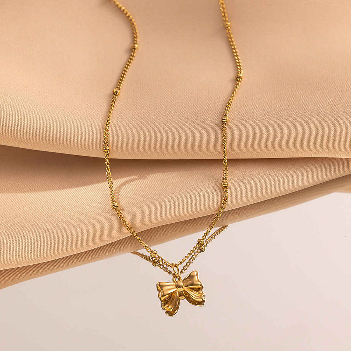 LabelShe Gold Plated Stainless Steel Bow Themed Pendant | LS-PS-26455