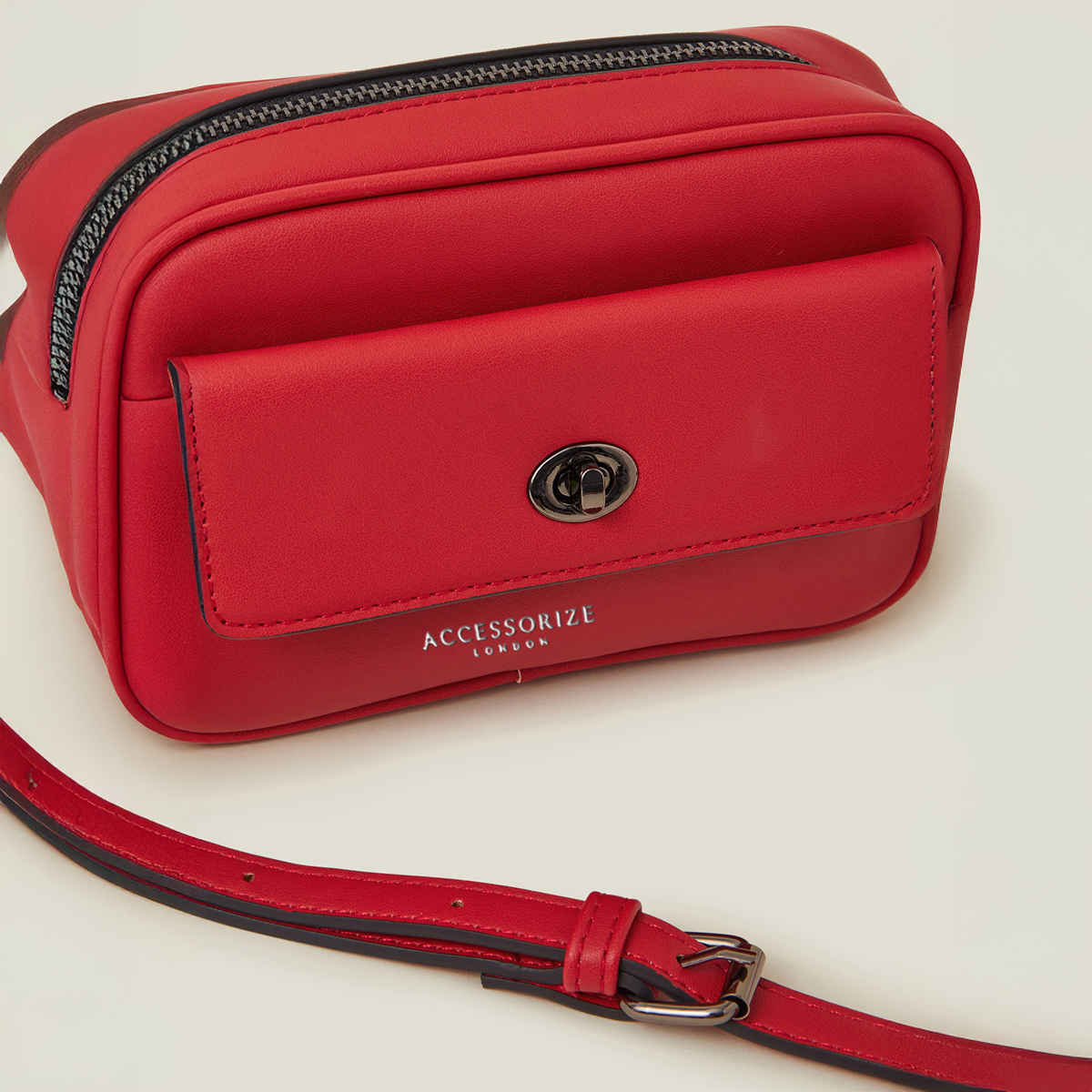 Accessorize London Women's Twist Lock Pocket Sling Bag | Red