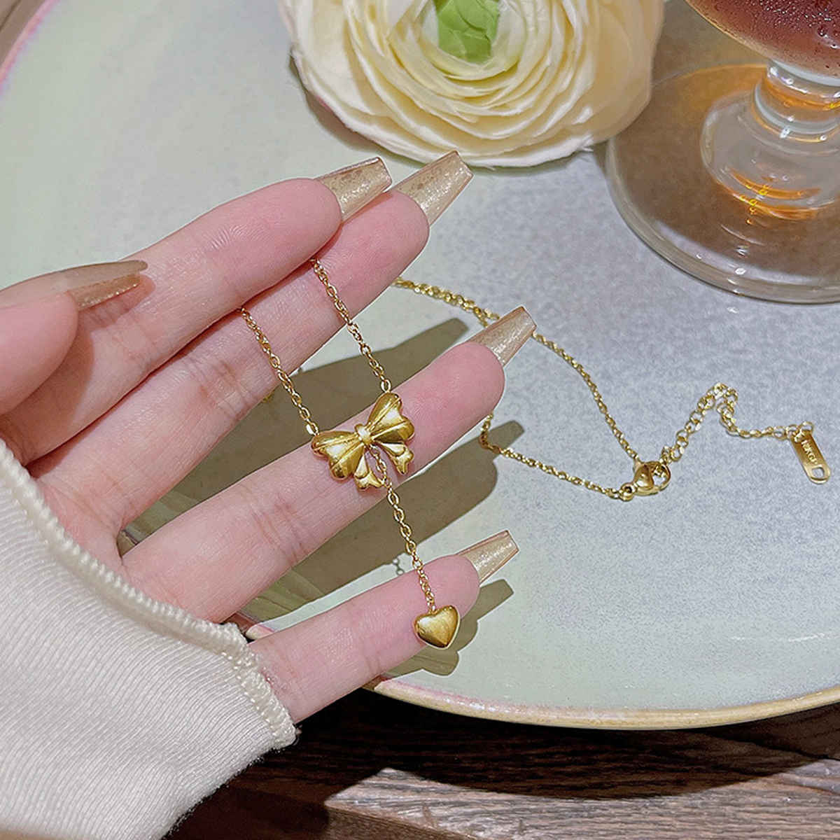 LabelShe Gold Plated Stainless Steel Heart Themed Bow Inspired Necklace | LS-NCK-67028