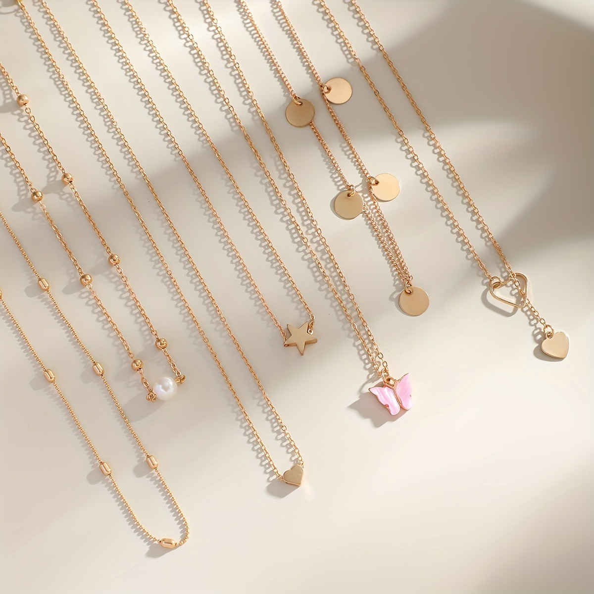 Jewels Galaxy Gold-Plated Gold-Toned Pack Of 7 Butterfly Layered Necklace (1 Pack 7 Necklaces)