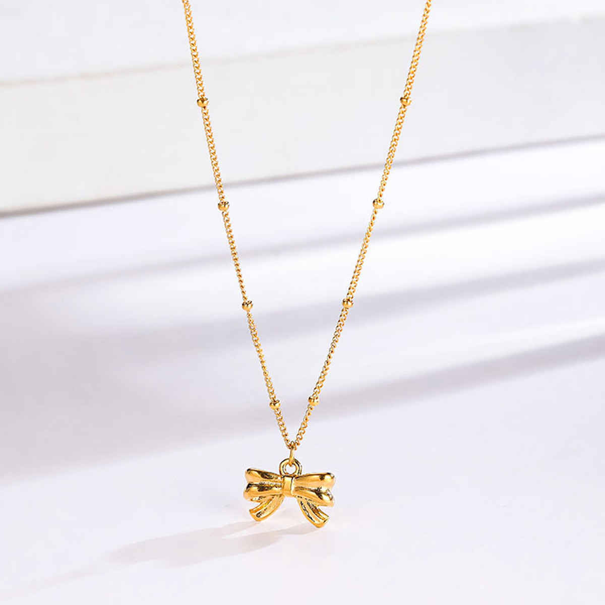 LabelShe Gold Plated Stainless Steel Bow Themed Pendant | LS-PS-26455