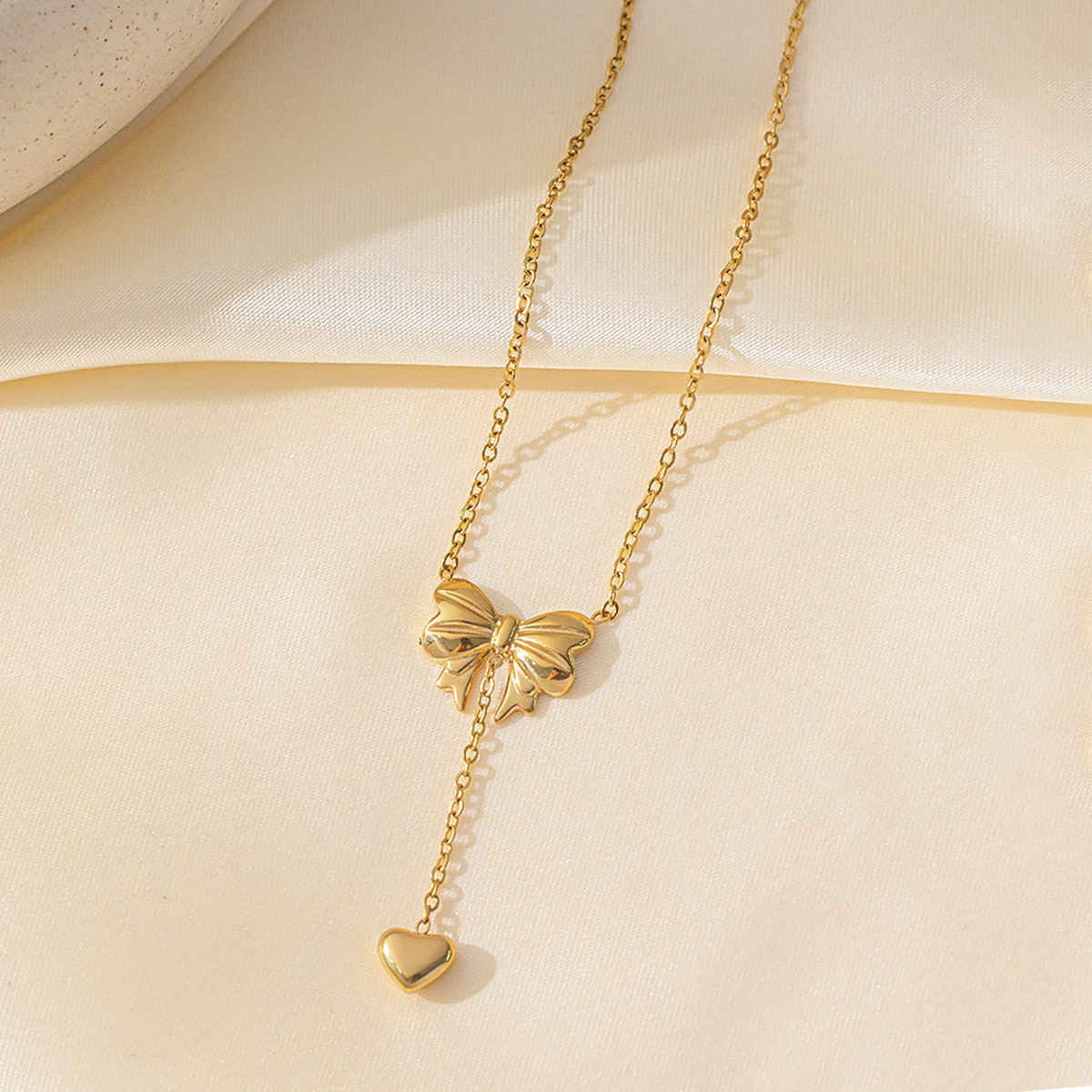 LabelShe Gold Plated Stainless Steel Heart Themed Bow Inspired Necklace | LS-NCK-67028