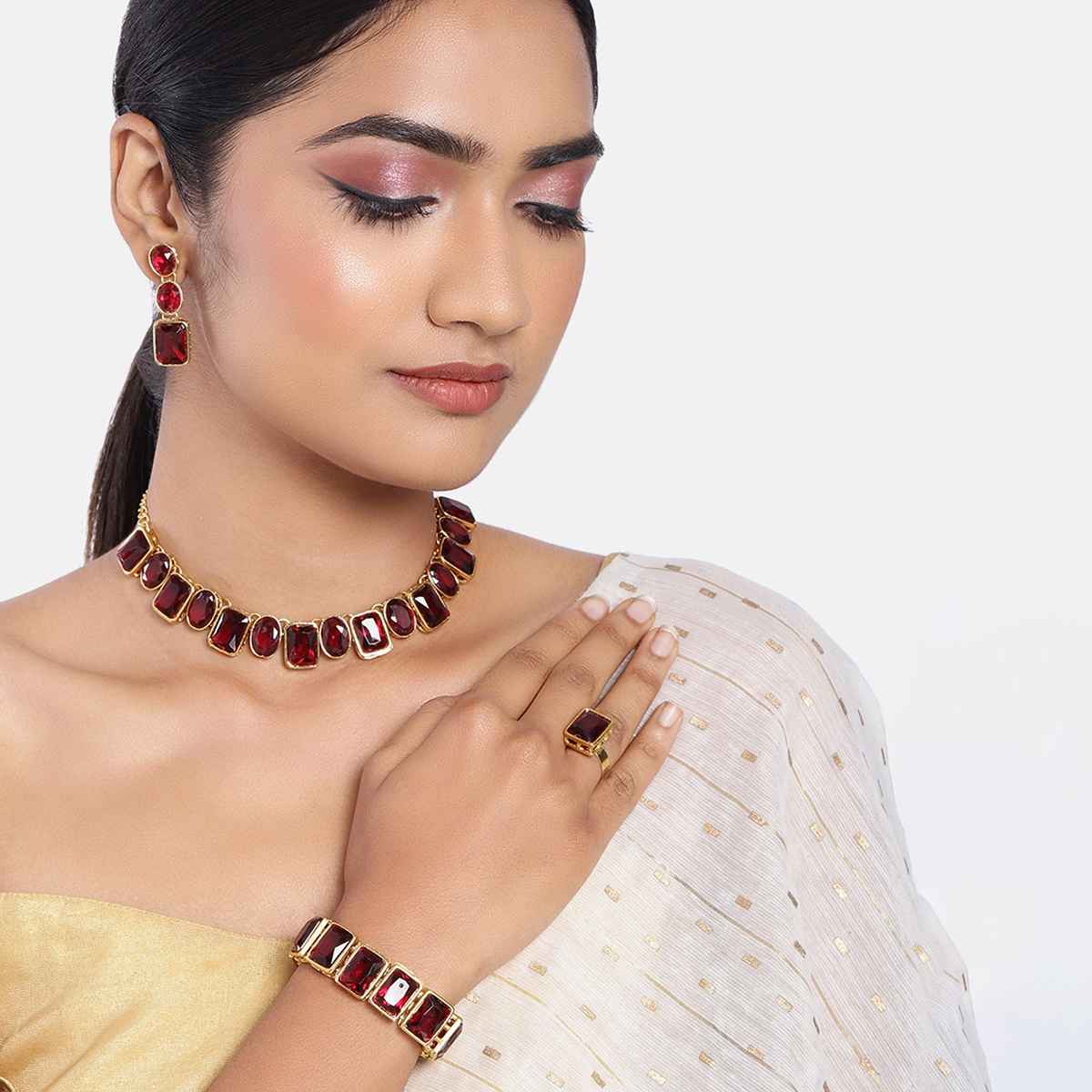 Peora Gold Plated Maroon Crystal Necklace Set with Drop Earrings, Bracelet, and Finger Ring